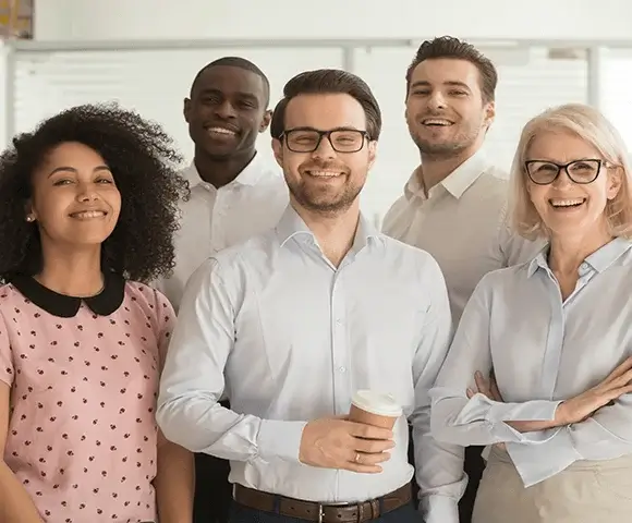 group of five people in an office enviroment