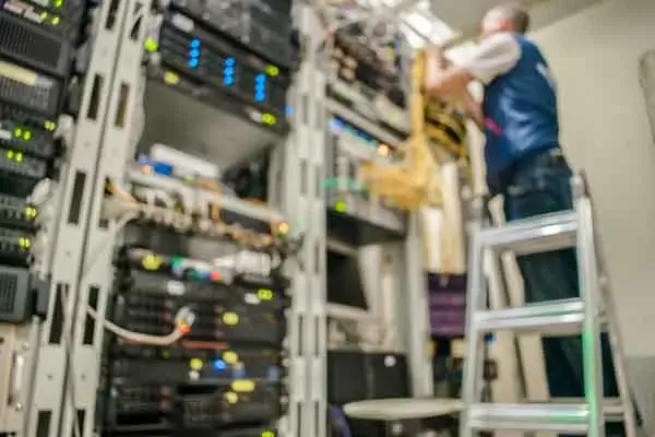 engineer working on data cables